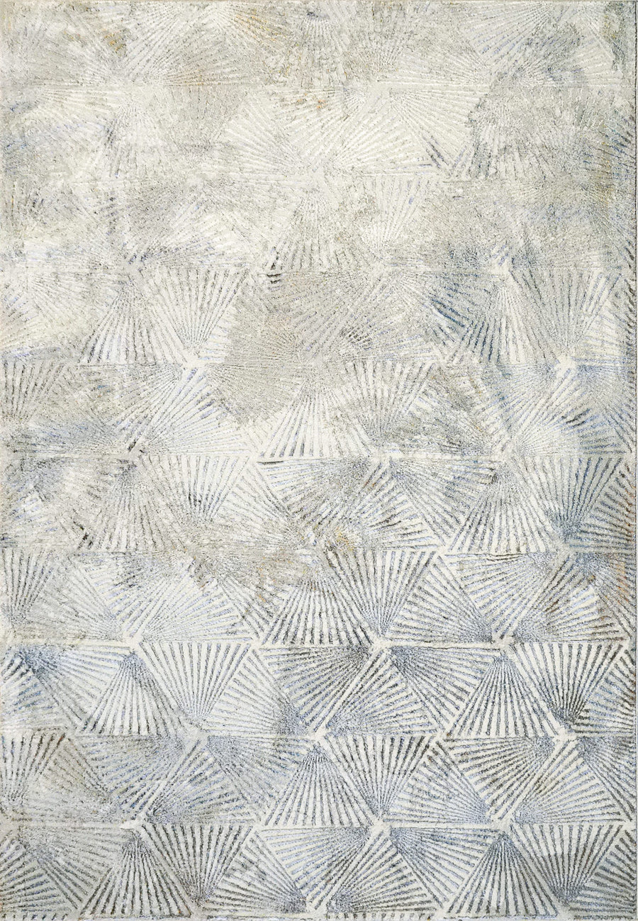 The Gold 1355 Area Rug features an abstract pattern in soft gray and beige, with overlapping geometric shapes and radiating lines. Machine-made in Turkey, this non-shedding rug adds a subtle, modern touch and lasting quality to any room.