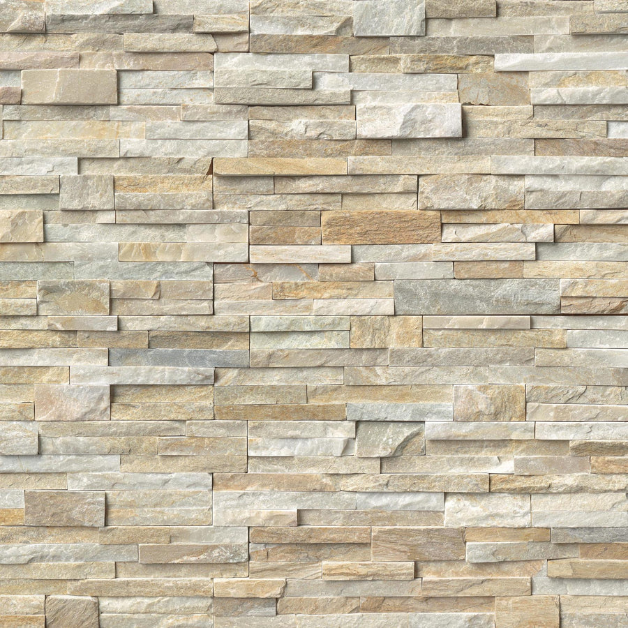 A wall built with Landscape 6x24 Natural Stone Ledger Panels showcases neatly stacked, rectangular split-face stone bricks in beige, tan, and light gray, creating a textured and uniform look.