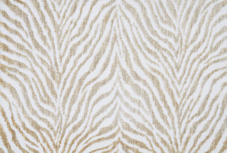 The Boteti On Trend Carpet features a tan and white zebra print with symmetrical, wavy lines for a textured, animal-inspired look. Its bold design makes it perfect for adding a modern touch to contemporary décor.