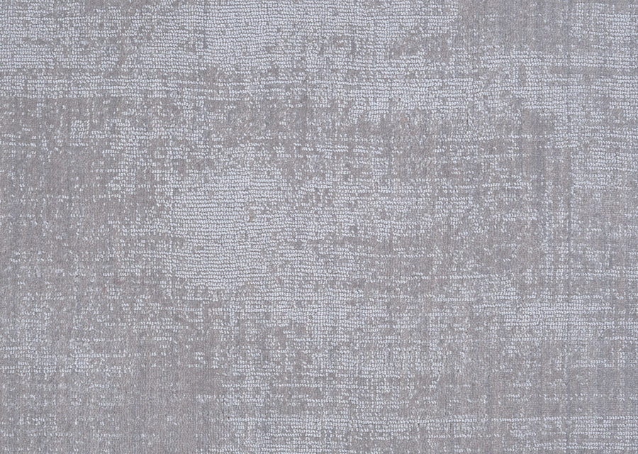 A close-up of the Prague On Trend Carpet in light gray highlights its textured, uneven woven pattern—adding sophisticated style that easily complements any modern color palette.