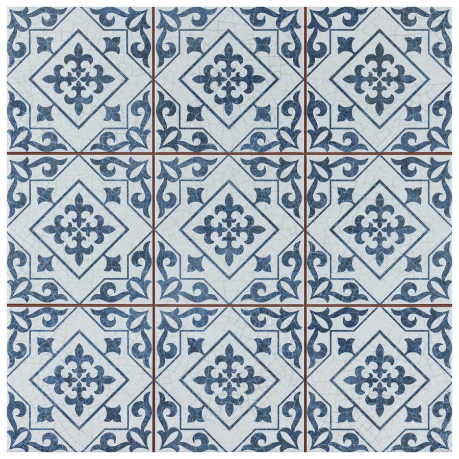 Nine Harmonia Atlantic 13x13 patterned ceramic tiles feature blue and white floral and geometric designs, arranged in a grid with diamond motifs and scrolling borders that connect each encaustic-inspired floor or wall tile.