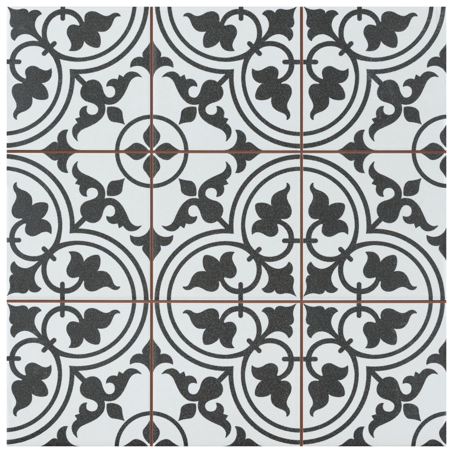 The Harmonia Classic 13x13 Patterned Tile features intricate black and white floral and geometric motifs in a symmetrical grid, accented by thin red lines at the edges, ideal for adding elegance to floors and walls.
