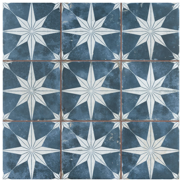 The Harmonia Kings Star 13x13 Patterned Tile is a blue and white ceramic tile for floors and walls, featuring a vintage industrial design.