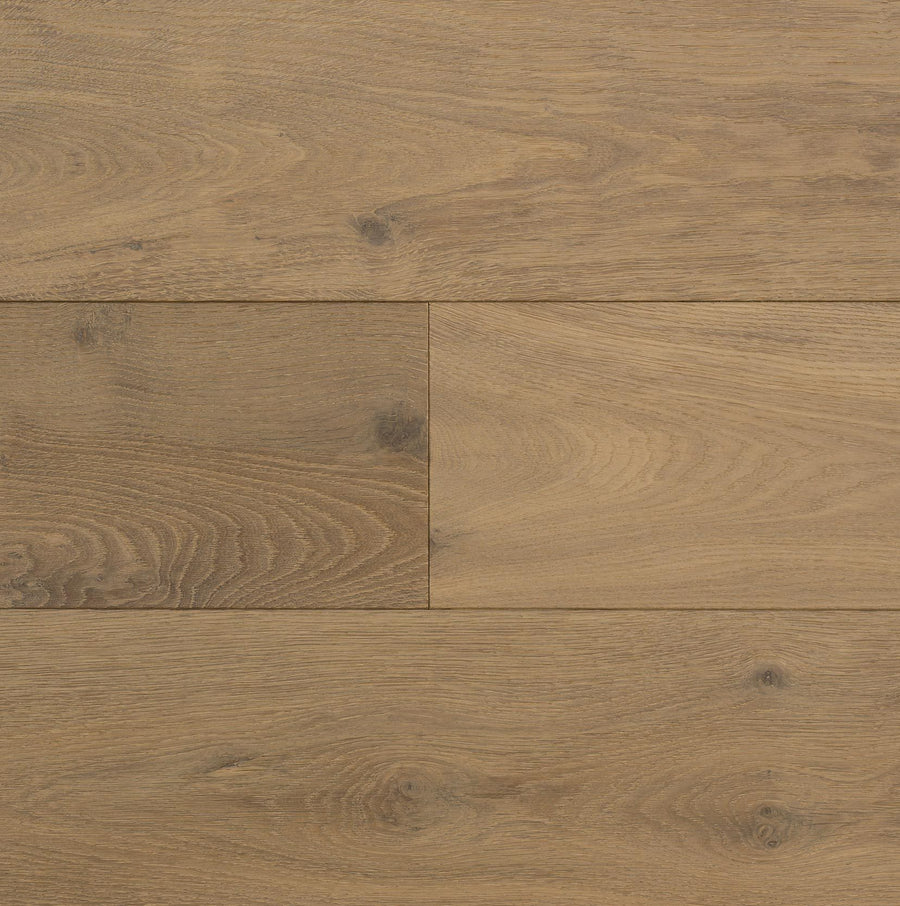 Close-up view of Huntington European Oak 7 1/2" Hardwood floorboards, featuring light brown tones, visible natural grain patterns and knots, arranged horizontally and finished with a subtle reactive stain.