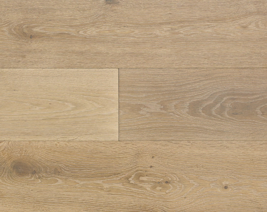 Close-up of Huntington European Oak 7 1/2" hardwood floorboards displaying light brown tones, natural wood grain, and knots, arranged in a staggered pattern with a subtle reactive stain for enhanced character.