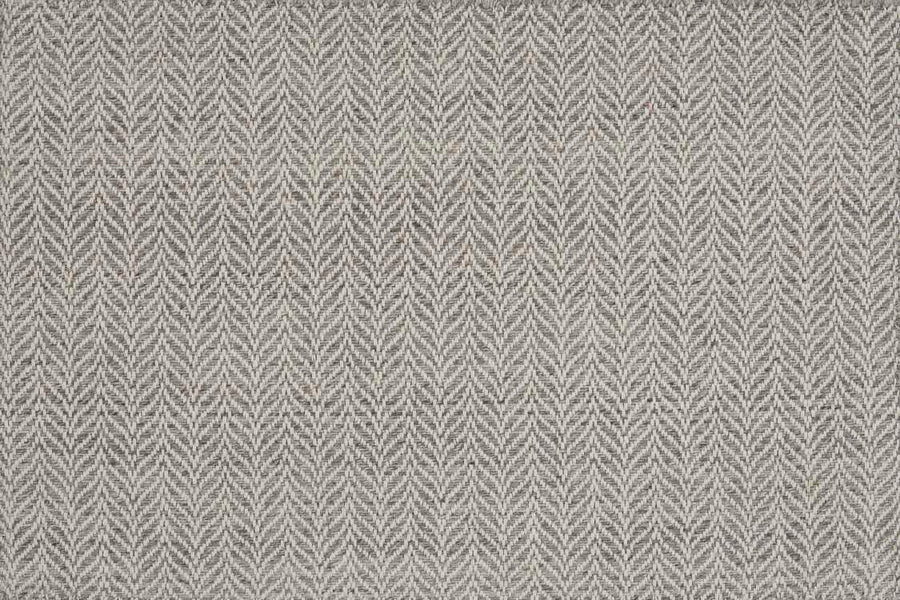 Close-up of Island Wave On Trend Carpet featuring a gray and white herringbone pattern with repeating chevron V shapes in a textured, hand-woven style.