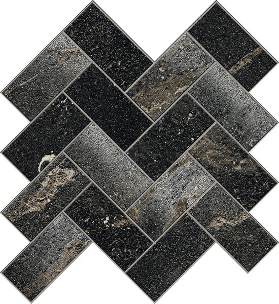 The Ibla Herringbone Mosaic Porcelain Tile features large rectangular tiles with a bold black and dark gray stone texture, arranged in a staggered herringbone pattern for a modern geometric look ideal for luxury interiors.