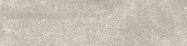 The Ibla 12x48 Large Format Porcelain Tile features a light grey, stone-like textured surface with subtle shade variations and a matte, slightly rough finish—perfect for modern interiors.