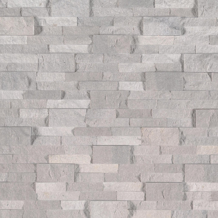 The Landscape 6x24 Natural Stone Ledger Panel features gray, rectangular split face stones in a staggered pattern. Subtle shade variations add depth and visual interest, making it perfect for modern, natural-looking wall designs.