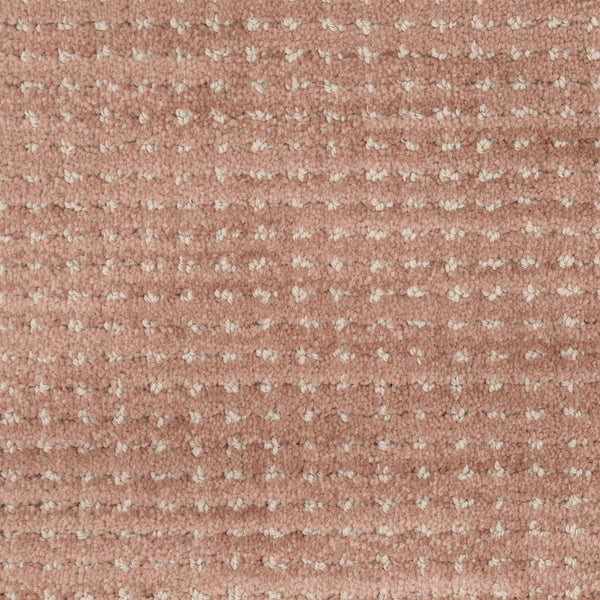 Close-up of Imagine Pet Friendly Carpet featuring a textured, dusty pink woven base with small, evenly spaced beige dots in a grid pattern, highlighting its handmade appeal.