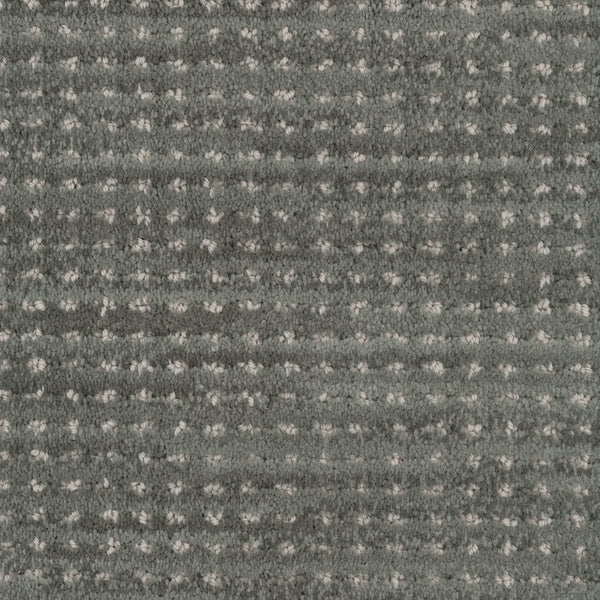 Close-up of Imagine Pet Friendly Carpet: textured gray wool with a soft, slightly fuzzy surface and a grid pattern of small, evenly spaced lighter dots and horizontal lines, showcasing handmade authenticity in every detail.