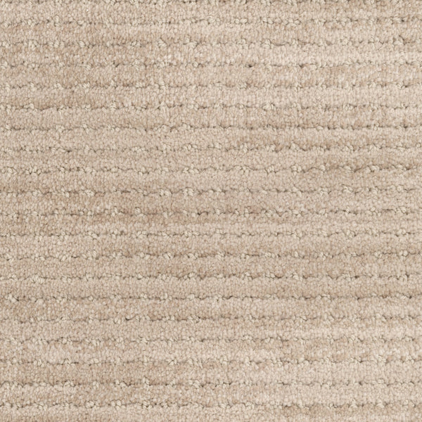 Close-up of Imagine Pet Friendly Carpet in beige, featuring a soft wool texture and horizontal striped pattern that highlights its handmade authenticity with subtle color variations.