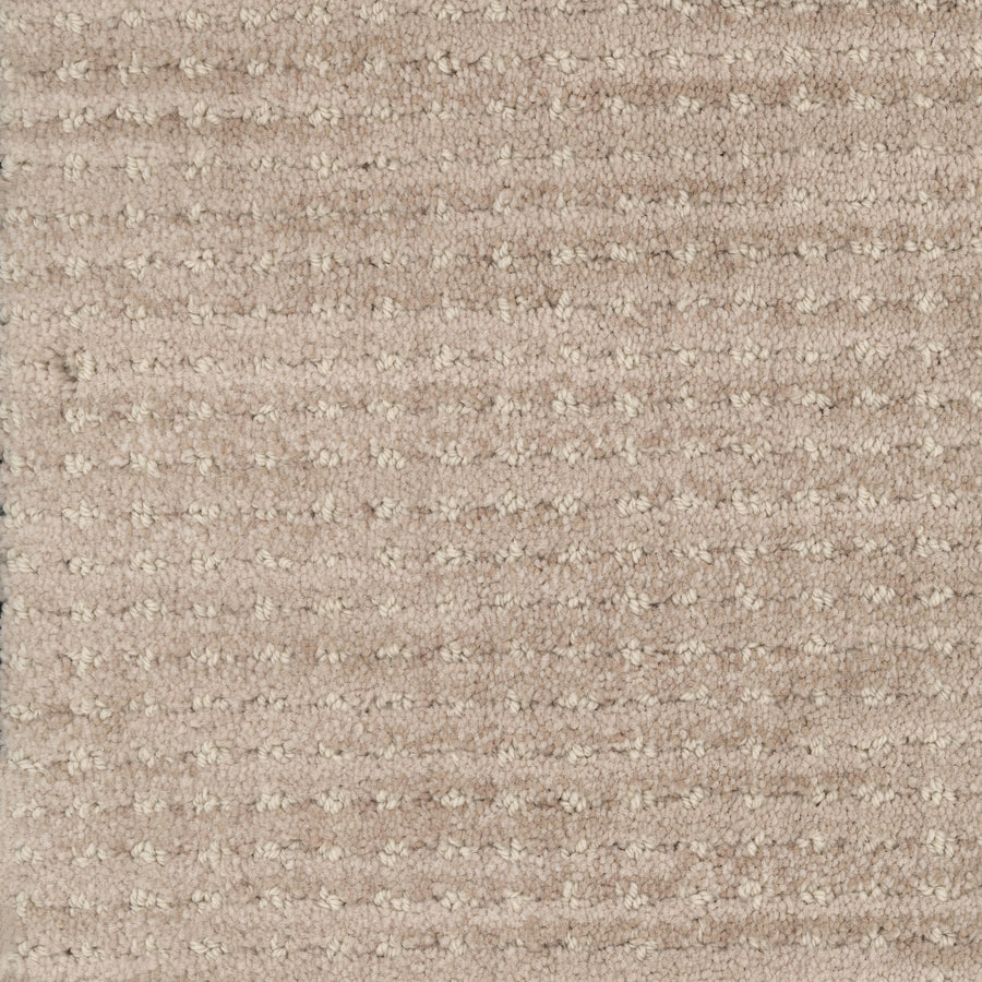 Close-up of Imagine Pet Friendly Carpet in beige, featuring a subtle horizontal stripe pattern and soft, woven texture with visible loops and fibers that showcase its handmade look.