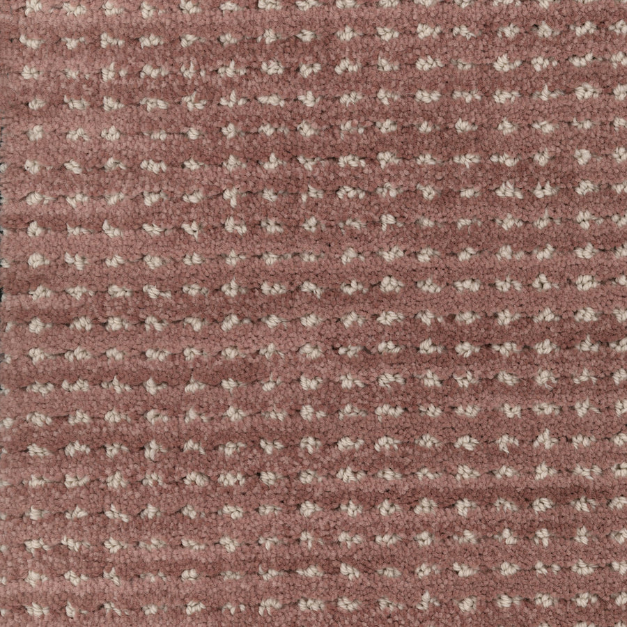 Close-up of Imagine Pet Friendly Carpet in muted pink, featuring a textured woven design with small, raised beige dots that highlight its handmade look.