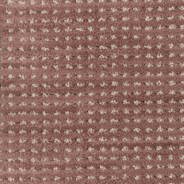 Close-up of Imagine Pet Friendly Carpet in muted pink, featuring a textured woven design with small, raised beige dots that highlight its handmade look.