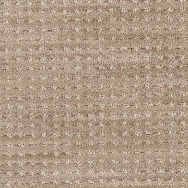 Close-up of Imagine Pet Friendly Carpet in beige, featuring a textured wool surface with a subtle, grid-like loop pattern that showcases its handmade appeal.