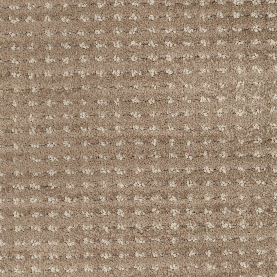 A close-up of Imagine Pet Friendly Carpet reveals a textured beige surface with a grid-like pattern formed by lighter, raised tufts. The soft fibers offer warmth and comfort, showcasing handmade authenticity in every detail.