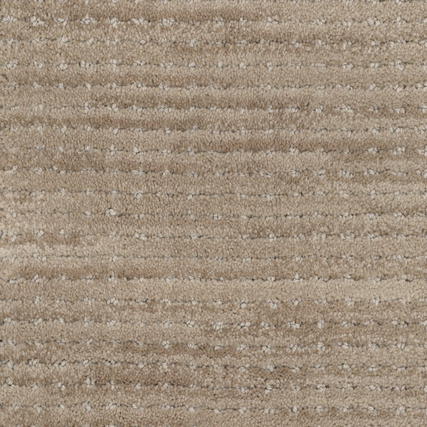 Close-up of Imagine Pet Friendly Carpet in textured beige, featuring horizontal lines and a speckled light brown and cream pattern that highlights its handmade look.