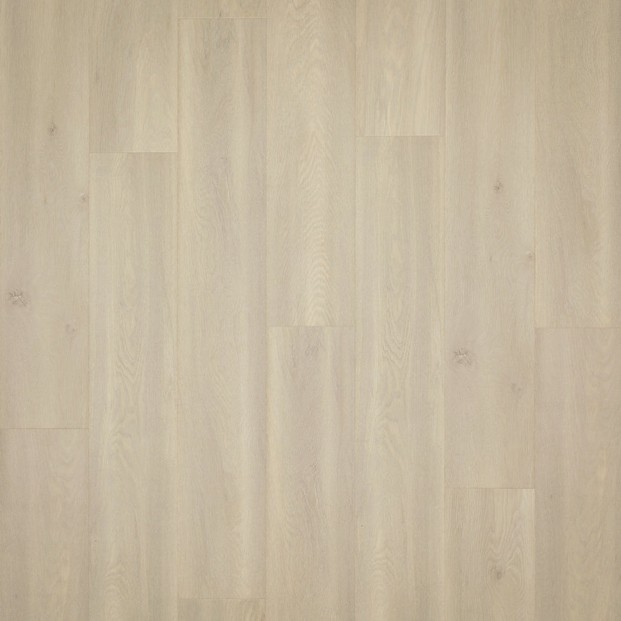 Miramar Cliffs 8.34" Waterproof Laminate features a light wood tone, smooth finish, and lengthwise grain patterns. This scratch-resistant flooring is installed in a staggered pattern for a clean, modern luxury look.