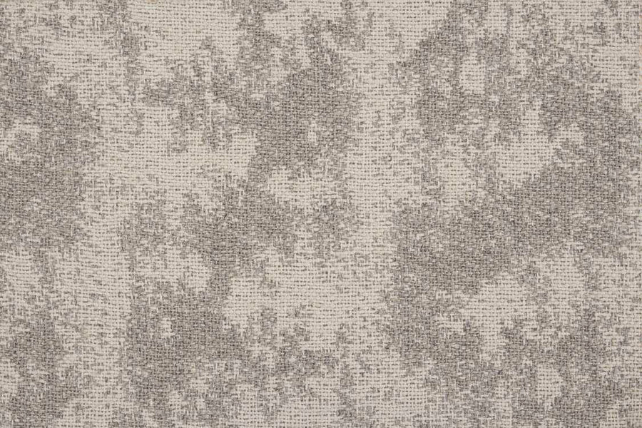 Close-up of a textured fabric featuring a beige background with irregular, mottled gray patterns similar to the Jacquard Abstract On Trend Carpet.