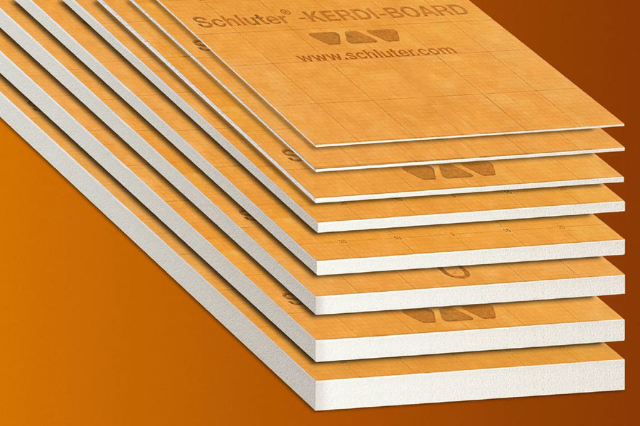 Several stacked Schluter Kerdi Board waterproof panels with white edges are displayed on an orange background. Featuring a grid pattern and logos, these panels serve as an ideal tile substrate for diverse applications.