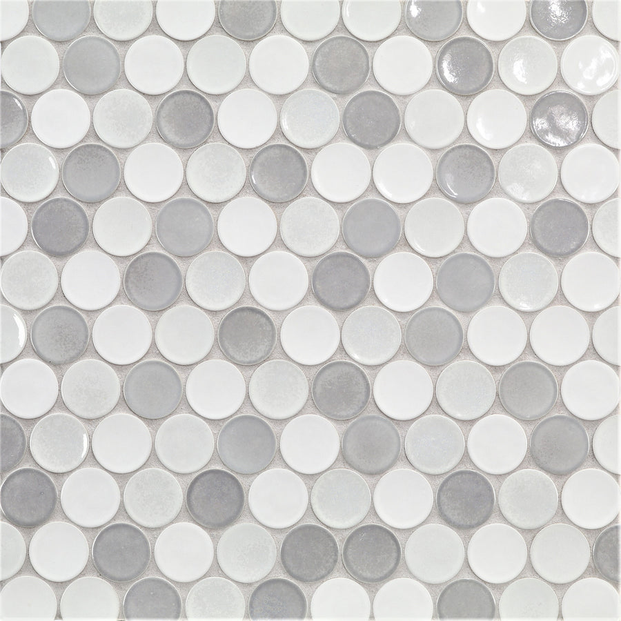 A close-up of Ka-Nu Buoy 2" Pennyround Mosaic Tile shows small, round ceramic tiles in white and light gray shades. The glossy finish highlights expert glazing and uniform spacing within the repeating grid pattern.