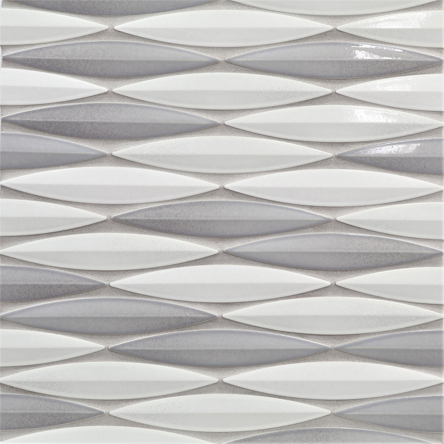 The Ka-Nu Keel 3D Mosaic Tile features elongated, diamond-shaped ceramic tiles in glossy white and light gray glazes, arranged horizontally for a modern look with a textured, three-dimensional effect.