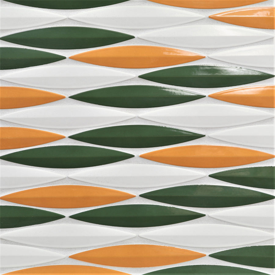 The Ka-Nu Keel 3D Mosaic Tile features elongated diamond shapes in green, orange, and white glazes, arranged in horizontal rows for a bold geometric look and textured, three-dimensional visual effect.