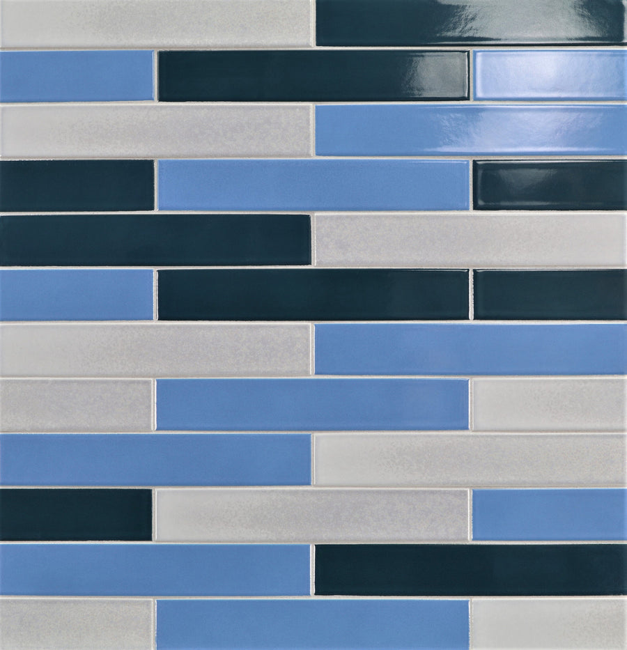 Ka-Nu 1 5/8 x 9 1/2" Plank Ceramic Tile features elongated rectangles in blue, dark green, and light gray. Arranged in a staggered pattern with a glossy finish, these tiles offer vibrant color and a sleek, modern look.