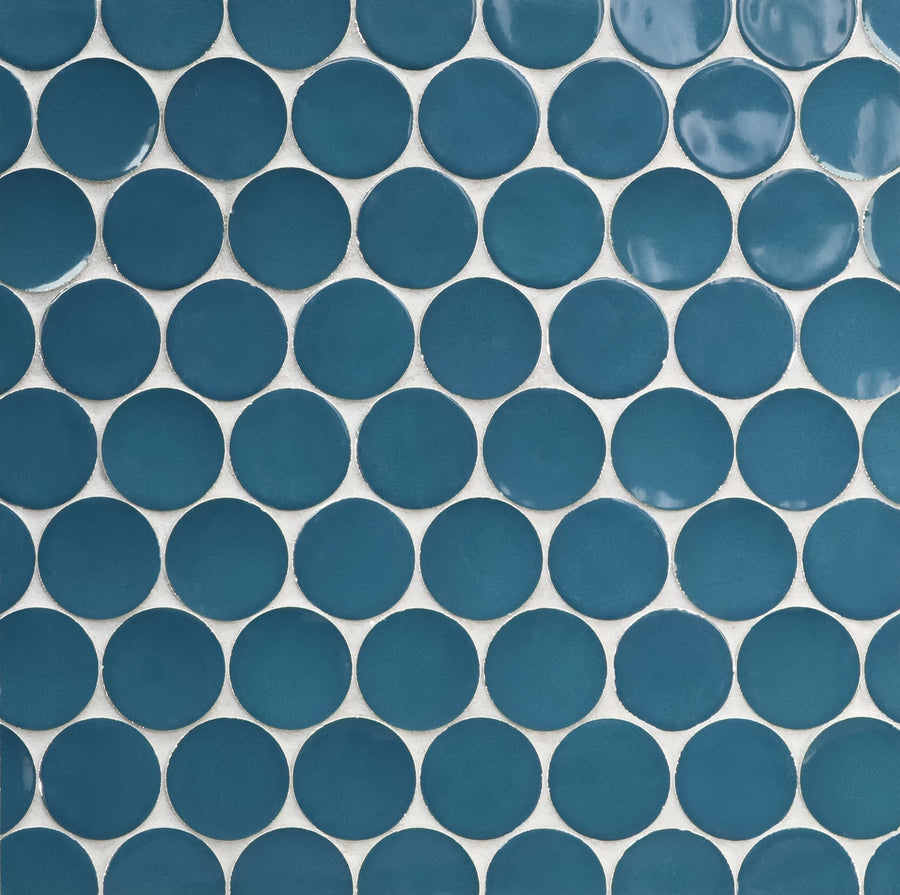 Close-up of Ka-Nu Buoy 2" Pennyround Mosaic Tile featuring evenly spaced round blue ceramic tiles in a grid pattern with white grout, highlighting the tile's refined glazing technique.