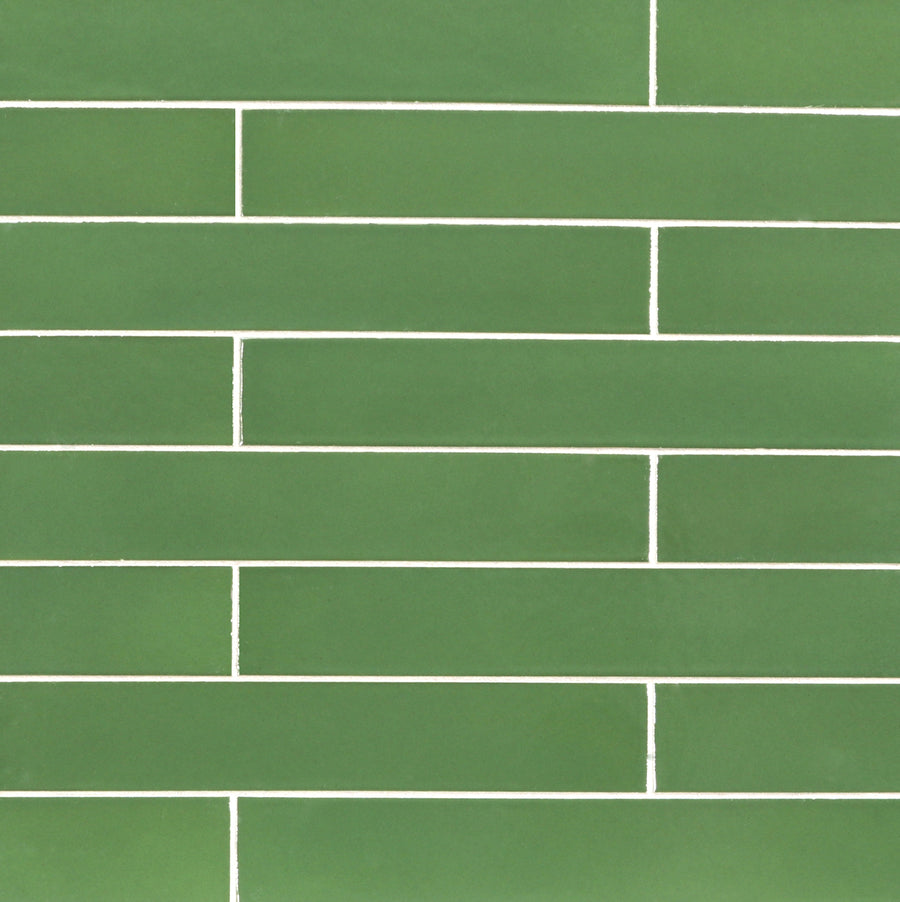 Ka-Nu 1 5/8 x 9 1/2" Plank Ceramic Tiles in vibrant green are laid horizontally in a brick pattern, with thin white grout lines separating each rectangular ceramic tile.