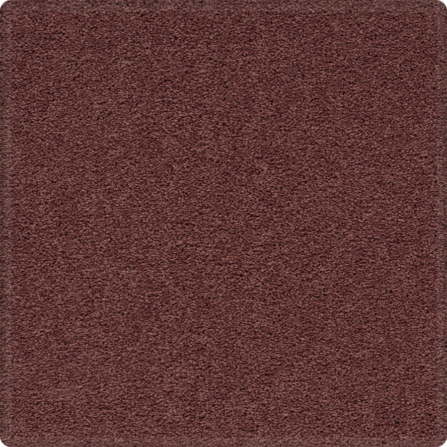 A close-up of the Dynamic Display Family Friendly Carpet, a rectangular, reddish-brown soft carpet with a textured surface and rounded corners—an easy-care, durable choice for any decor.