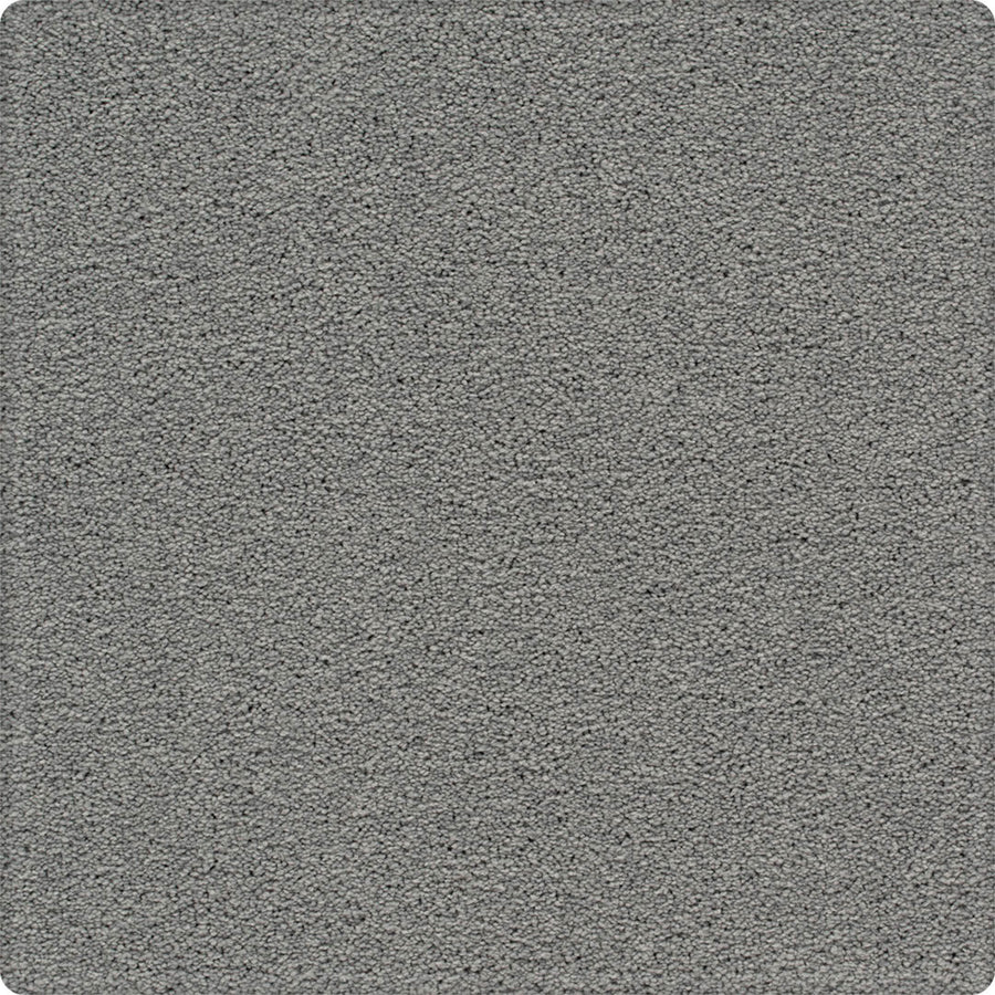 Close-up view of Dynamic Display Family Friendly Carpet in gray, highlighting its textured, durable surface—a decorator's dream for flawless finishes and easy-care maintenance.