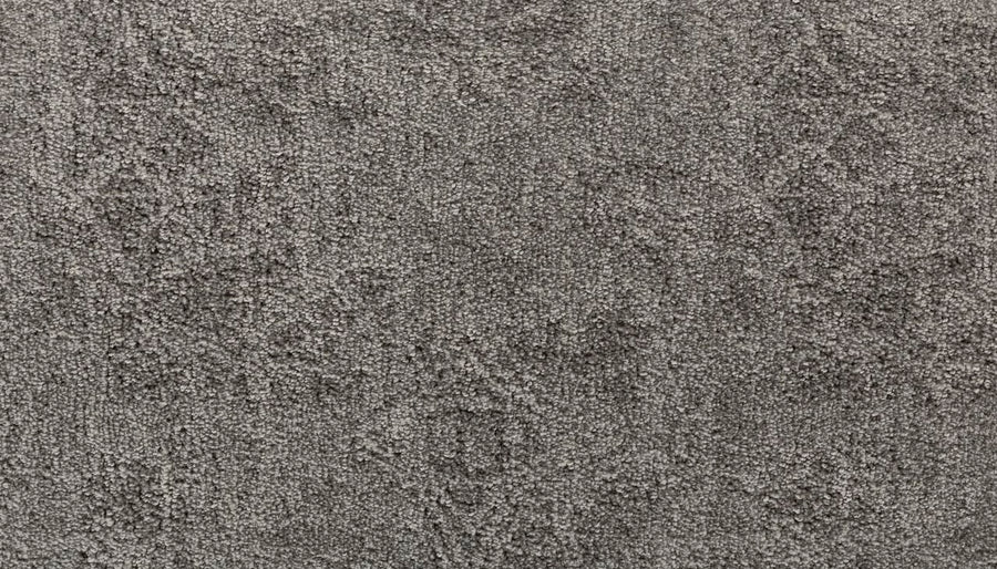 Close-up of Subtle Grandeur On Trend Carpet in textured gray, featuring a subtle mottled pattern and soft, plush surface made from premium Kashmere nylon for luxurious comfort.