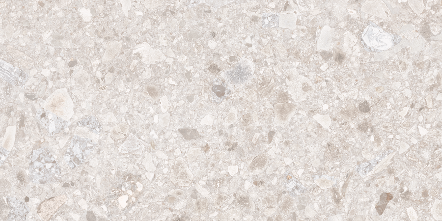 Close-up of the Amalfi 12x24 Porcelain Tile in beige, featuring a rough, stone-effect texture with varied rock fragments and mineral tones. Its uneven pattern and natural shades create a sophisticated look, ideal for luxury interiors.