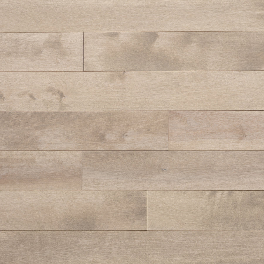 Lafayette 3 1/4" Birch Hardwood planks, arranged horizontally, feature subtle grain patterns and natural tone variations for a smooth, modern look.