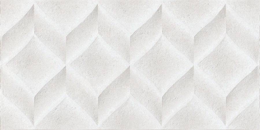 The Omni 12x24 Rectified Glazed Ceramic Tile features a textured white surface with geometric diamond patterns, offering a three-dimensional sculpted effect and subtle shadows for striking relief in any space.