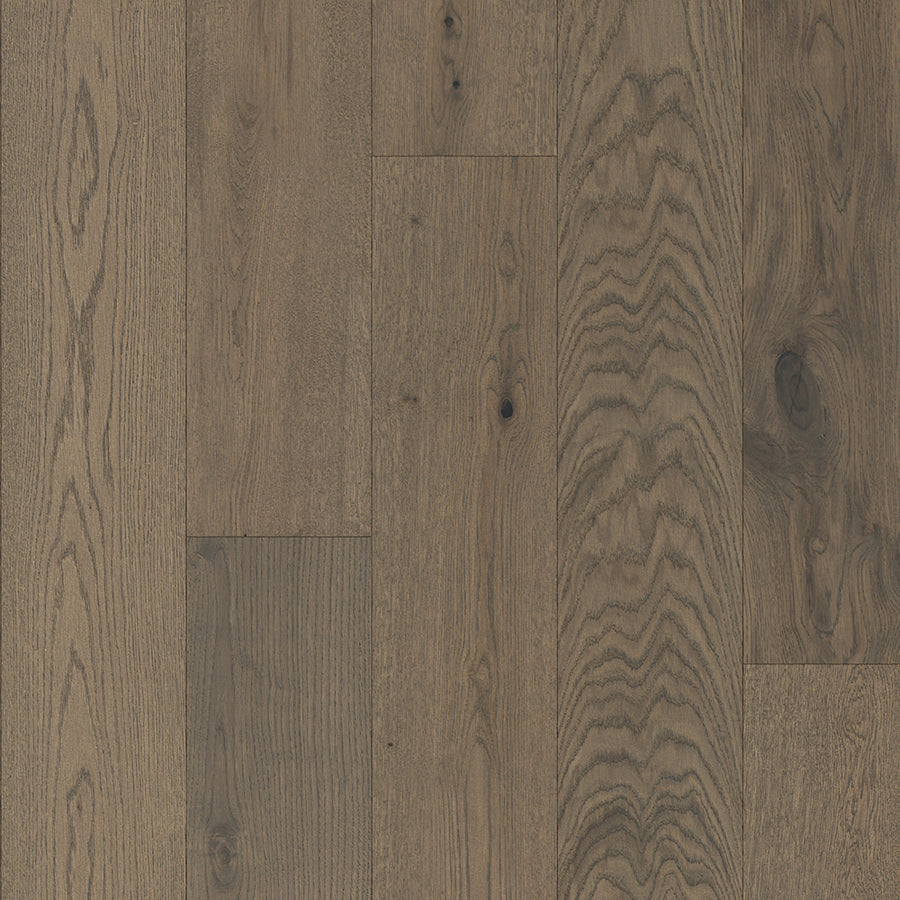 Close-up of Lexington Park 7 1/2" White Oak Hardwood planks with a rustic brown finish, matte sheen, and natural wood grain, knots, and unique textures highlighted in each plank.