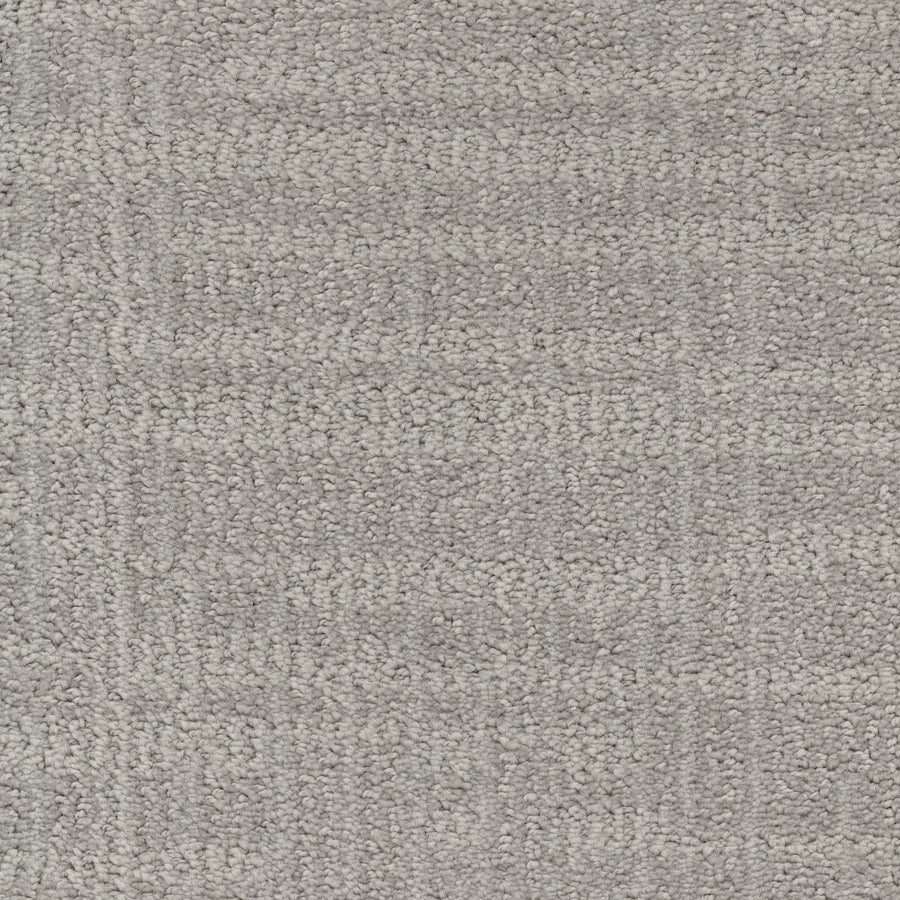 Lineage Pet Friendly Carpet in light gray features a subtle geometric pattern and soft, slightly raised texture with small, even loops—crafted from EnVisionSD yarn for a modern, uniform look that’s perfect for stylish, durable flooring.