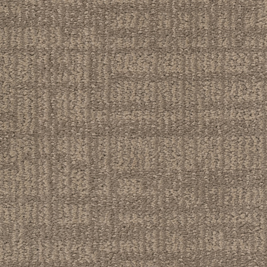 Close-up of Lineage Pet Friendly Carpet, a textured brown option with a subtle geometric pattern. Made with solution dyed EnVisionSD yarn for lasting color and durability—perfect for timeless flooring in any space.