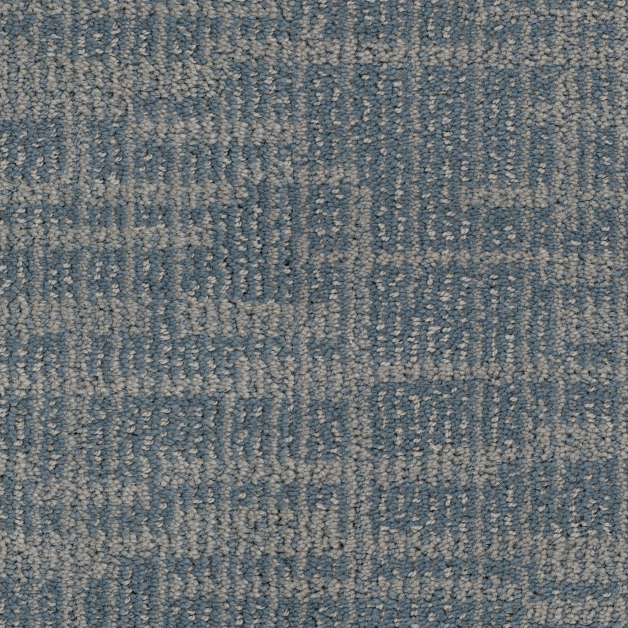 Close-up of Lineage Pet Friendly Carpet in blue and gray, featuring a subtle geometric checkerboard pattern. Made with EnVisionSD yarn, its soft looped pile and repeating rectangles offer enduring style and pet-friendly durability.