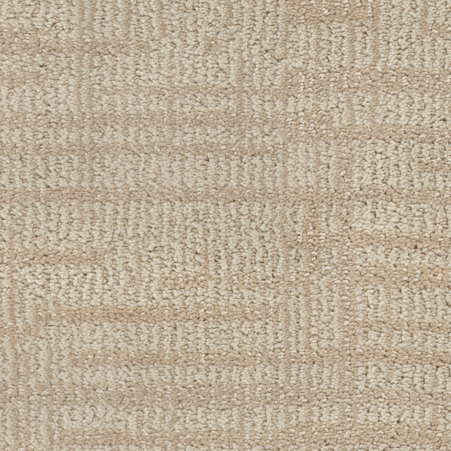 Close-up of Lineage Pet Friendly Carpet in beige, crafted with EnVisionSD yarn. Its plush, solution-dyed surface features a subtle textured pattern of interlocking rectangles and lines for a soft, modern look.