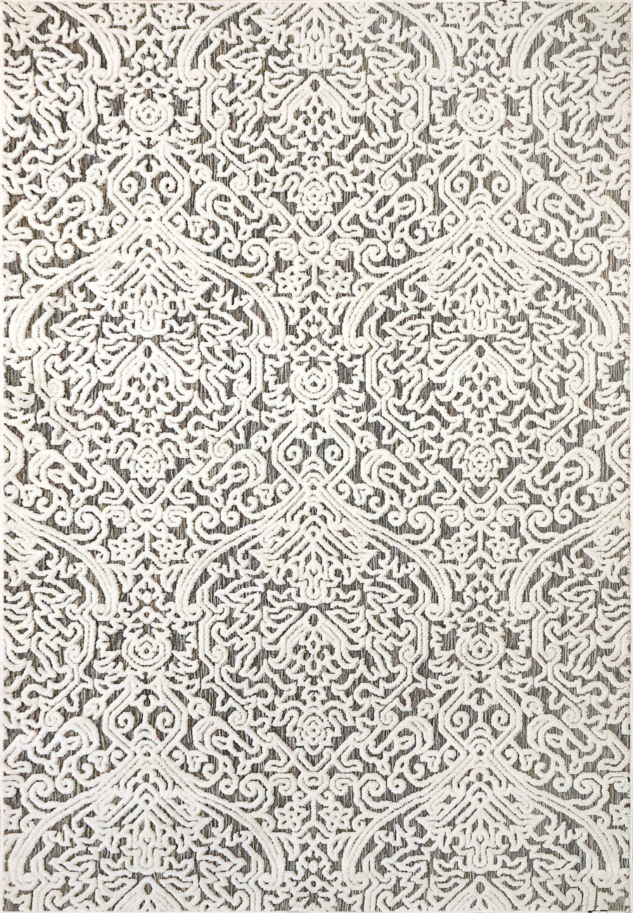The Lotus 8147 Area Rug is a beige and gray contemporary rug with an intricate damask pattern, featuring ornate scrolling floral and geometric designs in a high-low texture.