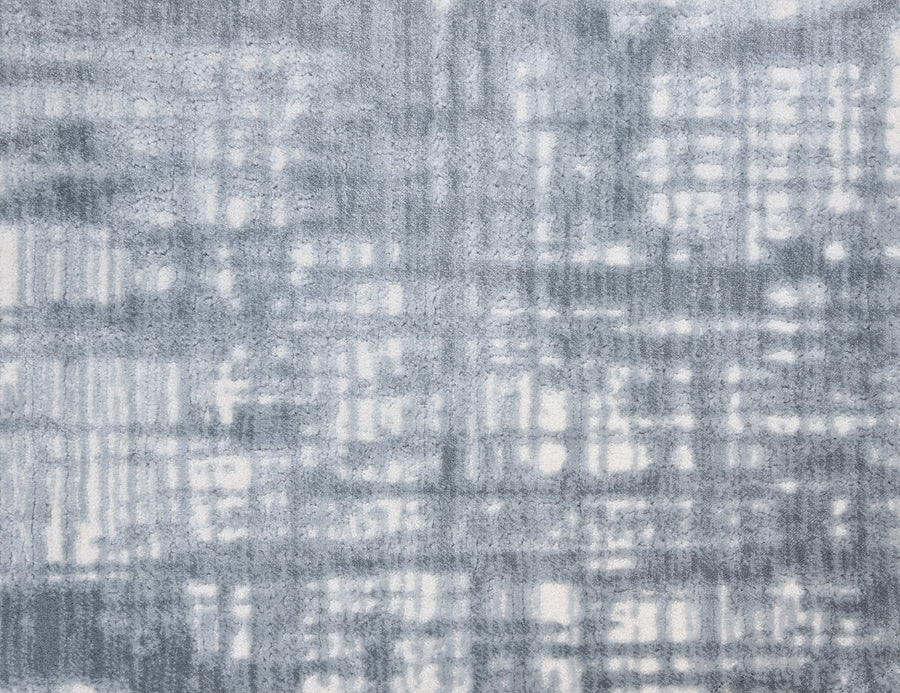 Textured intersecting lines in gray and white evoke the woven elegance and intricate detail of Lulubella On Trend Carpet.