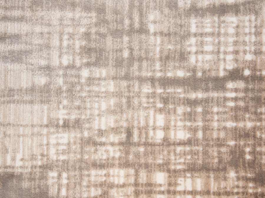 Abstract image with beige and brown tones features a grid-like, blurred pattern reminiscent of the Lulubella On Trend Carpet, evoking the look of a custom-finished rug or soft, weathered fabric.