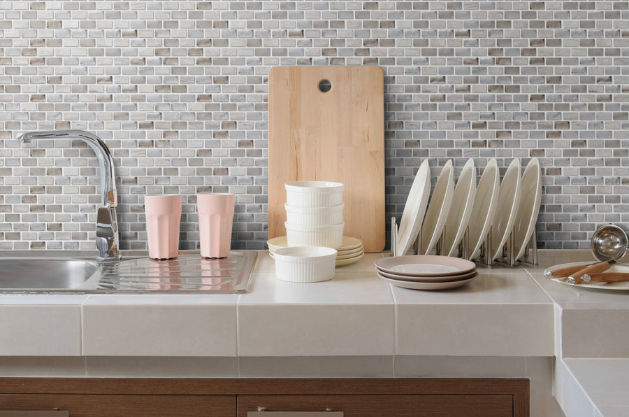 The Luna Mini Brick Textured Mosaic Glass Tile brings a classic look to your kitchen or bath, blending style and function with its elegant glass design—perfect for enhancing counters, backsplashes, or accent walls.