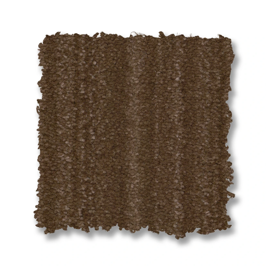 A square sample of Magnifique On Trend Carpet in brown with a looped pile pattern is displayed on a white background. The slightly uneven edges emphasize the homey texture and timeless beauty of its carpet fibers.