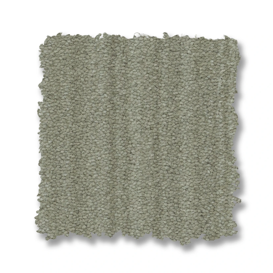 A rectangular swatch of Magnifique On Trend Carpet in textured light gray, featuring a looped pile and slightly irregular edges, is showcased on a white background.