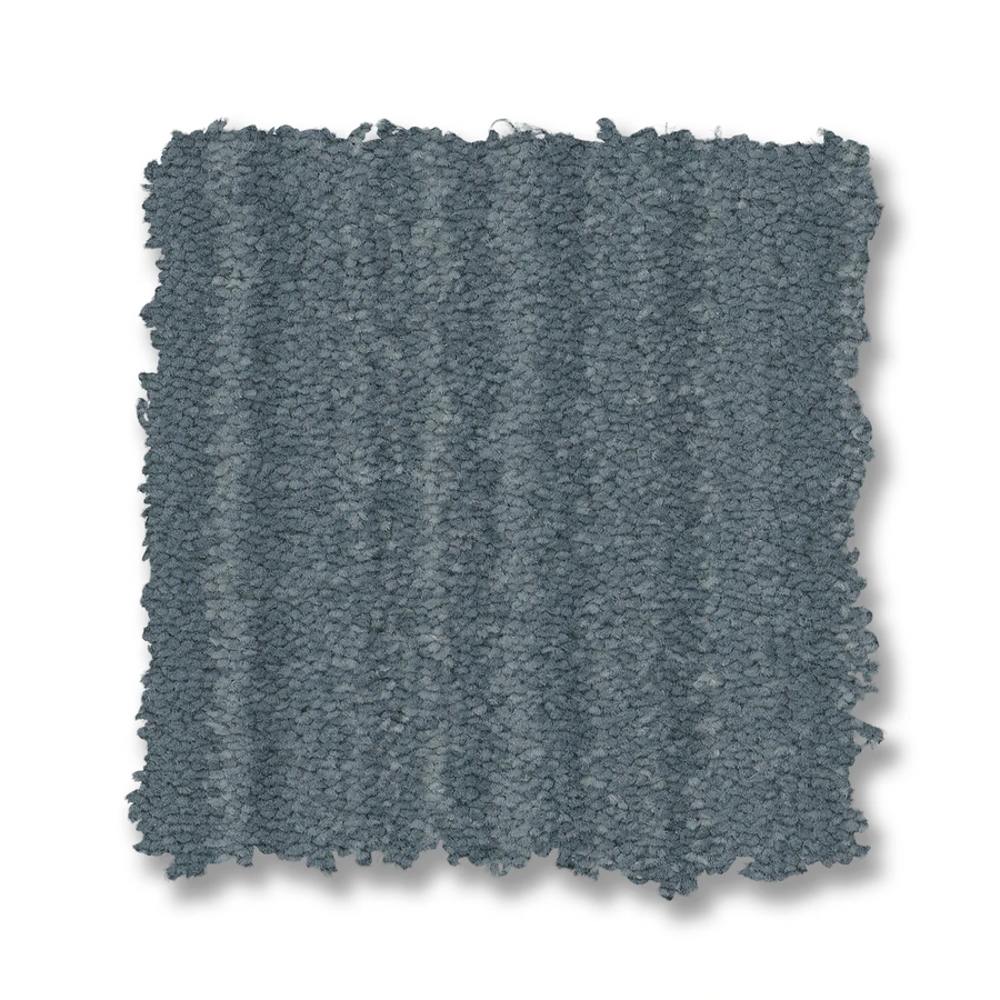 The Magnifique On Trend Carpet features a stylish grey color and square pattern, bringing timeless beauty and subtle texture to any room in your home.