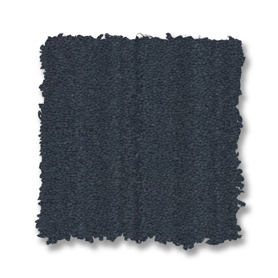 A square swatch of Magnifique On Trend Carpet in dark, textured fabric with slightly uneven, frayed edges is shown on a white background—ideal for adding timeless beauty and texture to any room.